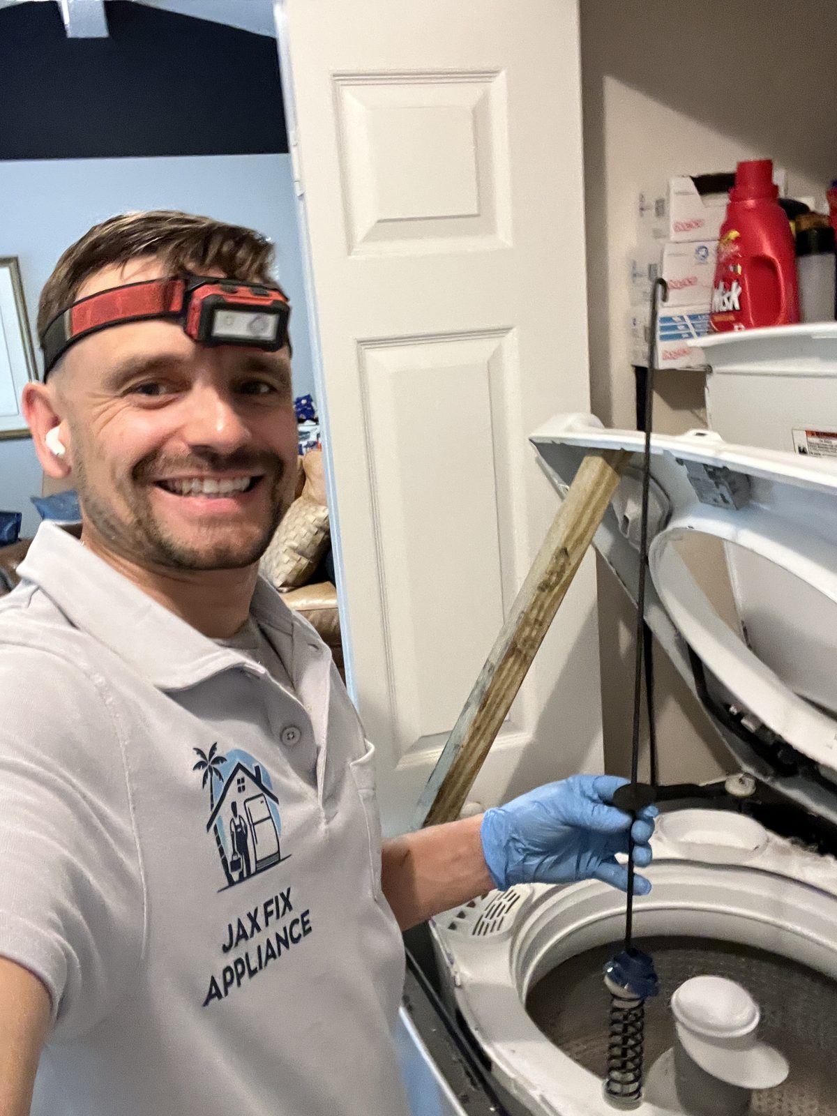 Konstantin replacing a suspension rod on a top-load washer